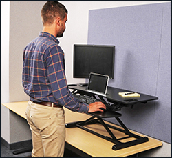 The standing desk rises from 4.2 to 19.7 inches above your desk height.